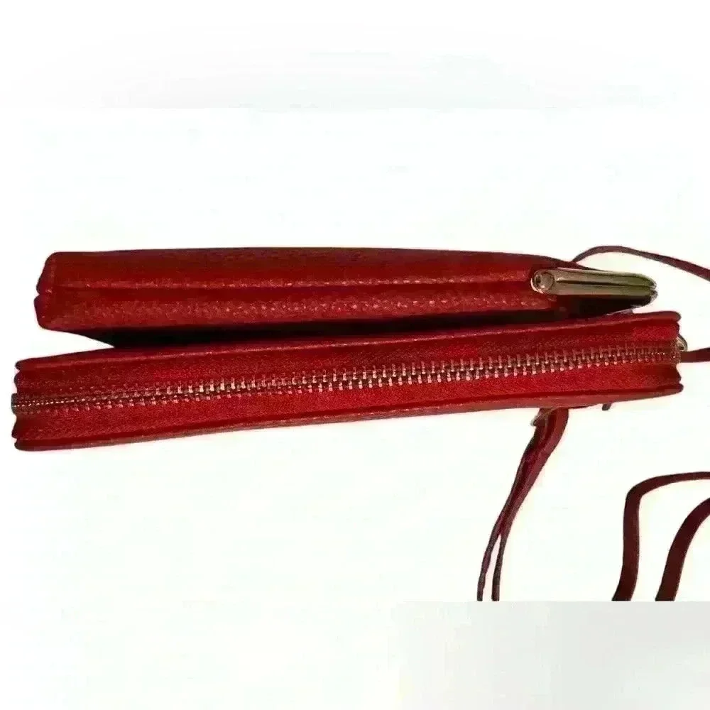 A Forever Young red woman’s,Crossbody bag / wallet with attached iPhone carrier.